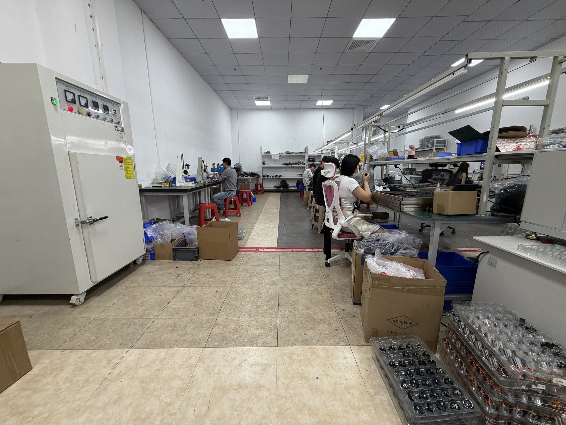 Yadovex factory production lines with workers assembling motors