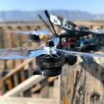 X2807 1300KV FPV brushless motor mounted on a drone with a transparent propeller, outdoor flight scene